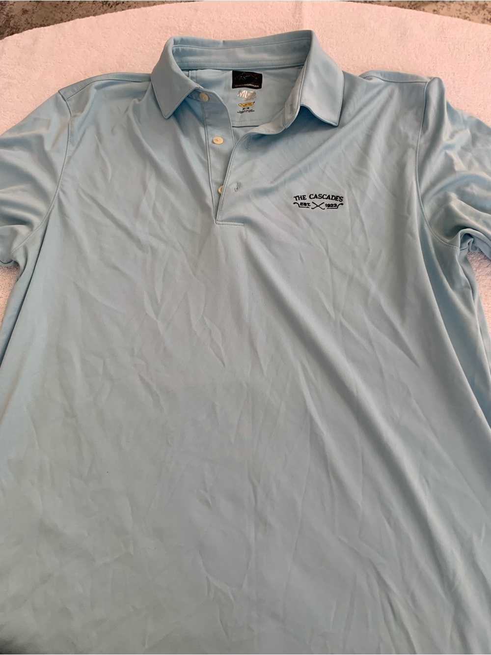 Greg Norman Collection Light Blue Polo with 'The Cascades' Logo